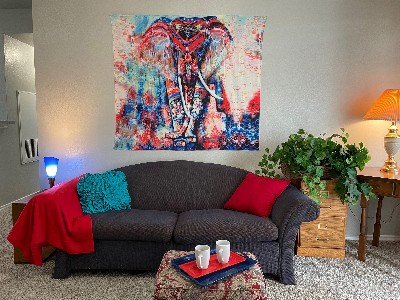 furnished couch with elephant painting