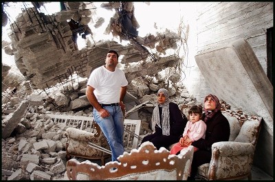 palestine family in rubble